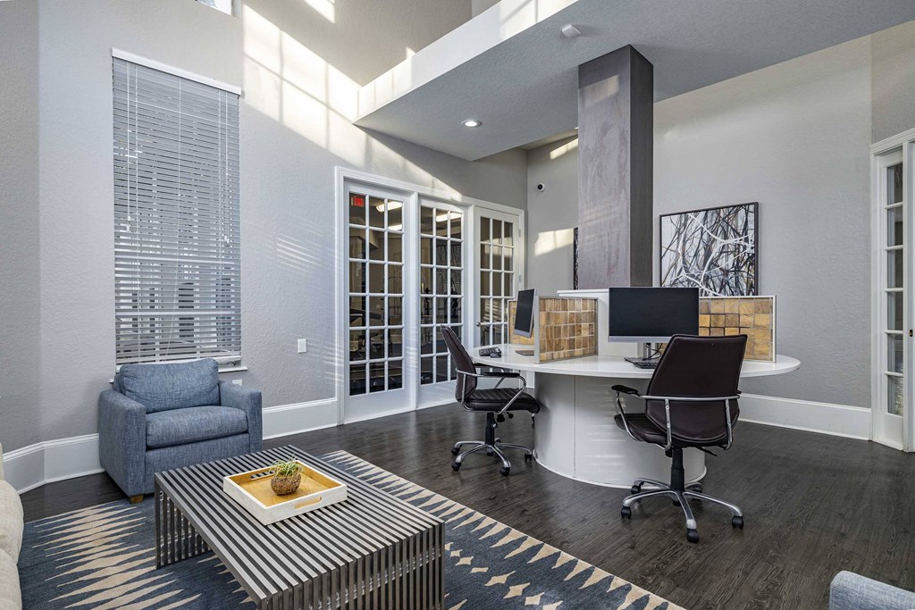 a home office with a desk and a chair