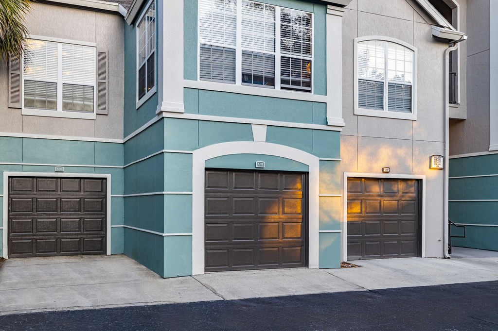 a house with two garage doors on the side of it