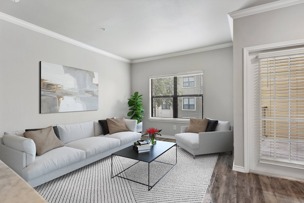 a living room with a white couch and a coffee table