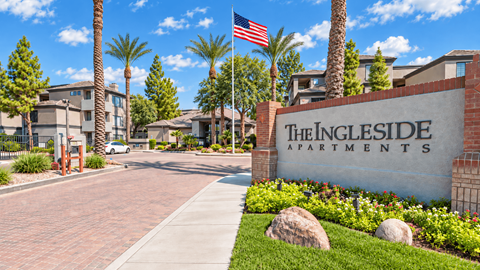 The Ingleside Apartments sign is displayed in front of a building with palm trees.