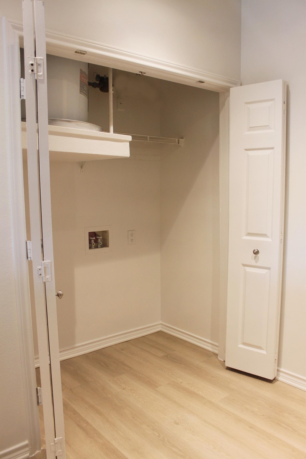 a room with a closet and a white door