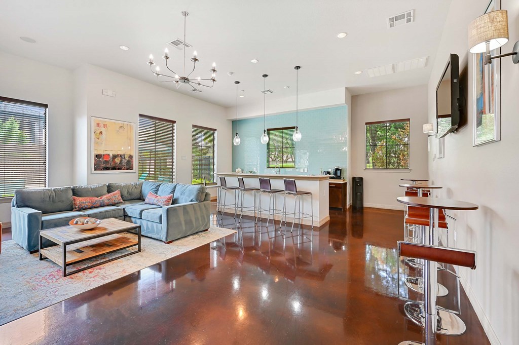 the living room is open to the kitchen and dining room