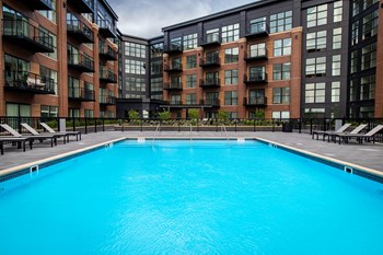 Large Fenced-in Community Pool with Lounge Seating - Photo Gallery 4