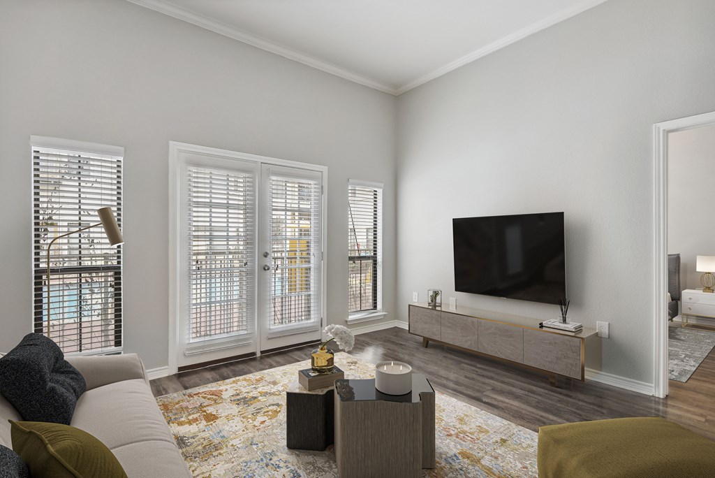 an apartment living room with a couch and a tv