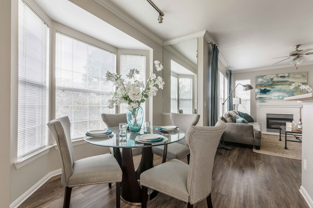 a dining room with a table and chairs