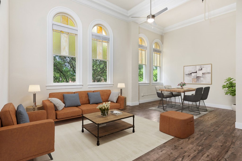 The St John Historic Apartment Home Living and Dining Room with Original Stained Glass Windows