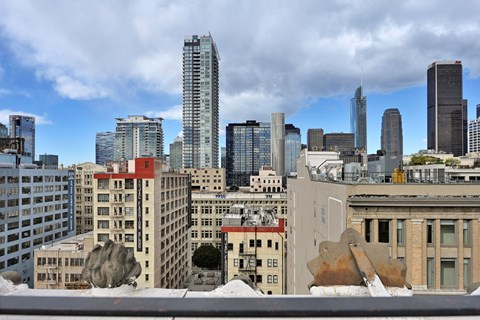 A cityscape with a mix of modern and older buildings.