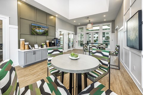 a dining room with a table and chairs