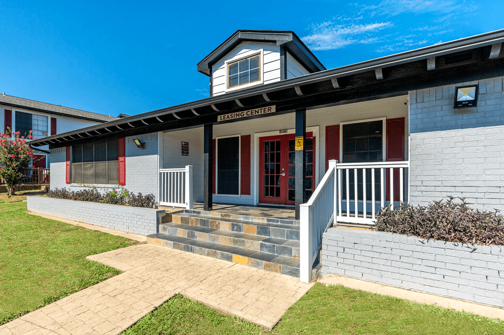 a view of the front of the building with a blue sky in the background