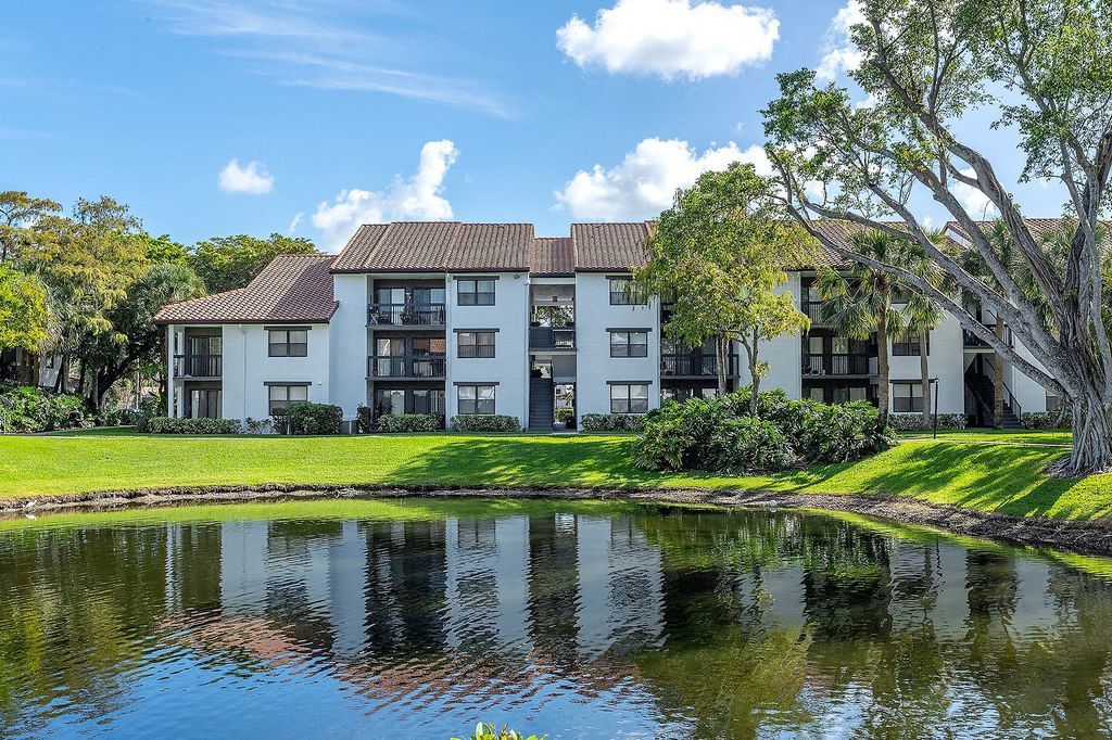 Exterior view of apartment building across from lake
