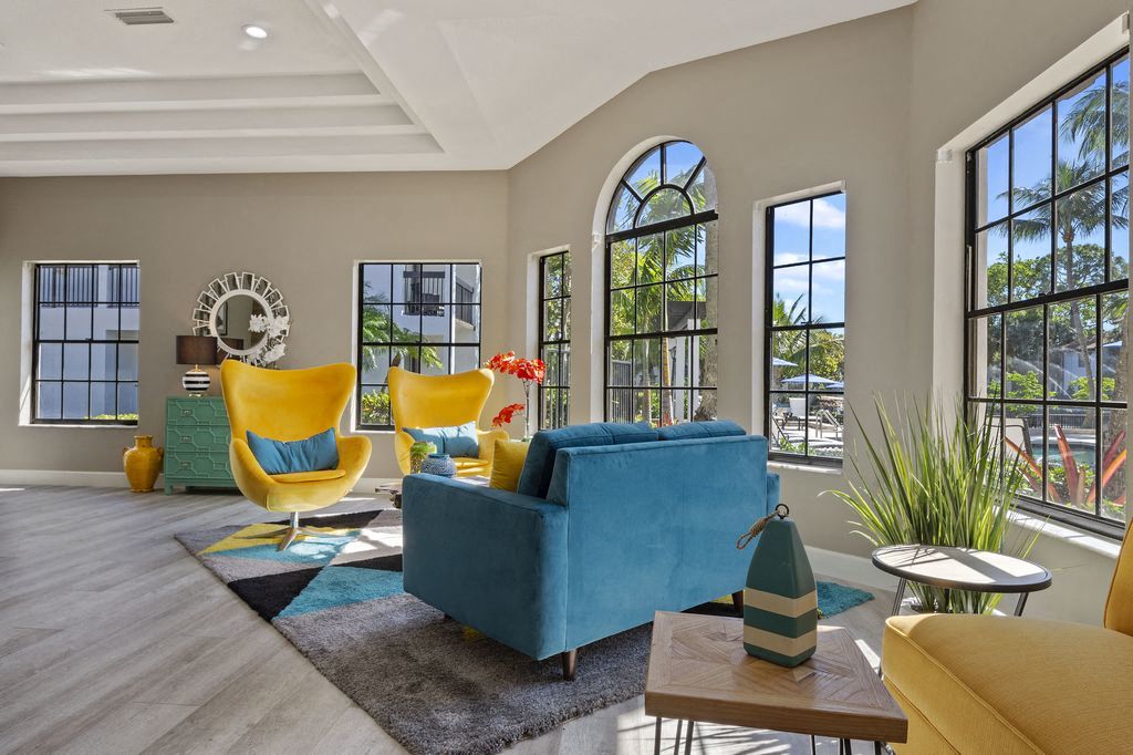 Sitting area in leasing office with floor to ceiling windows