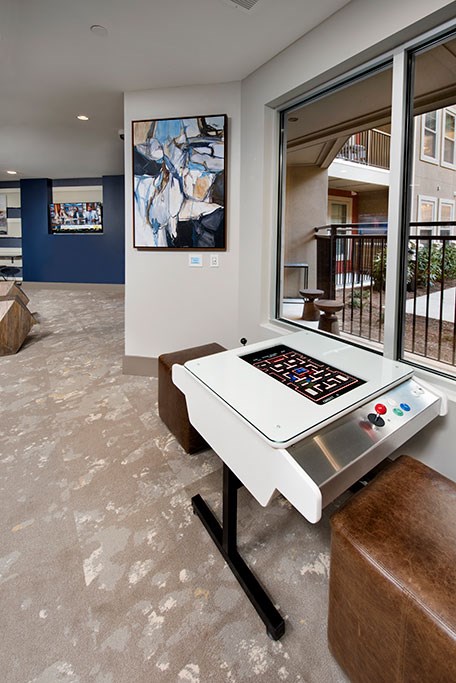 a game table in a living room with a large window