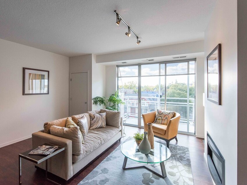 Living room of 1800 Lake with balcony and a fireplace
