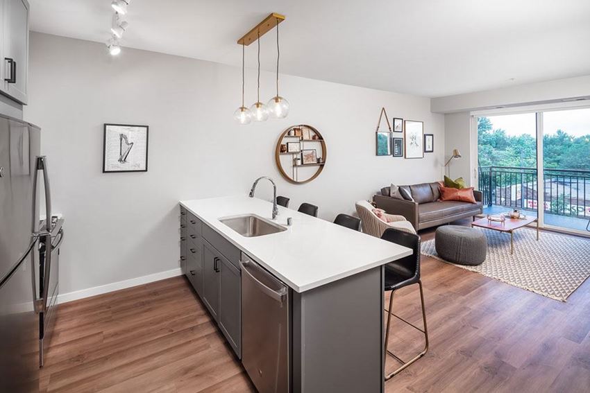 Interior Kitchen island with wood flooring at Harper Apartments in St Paul, MN