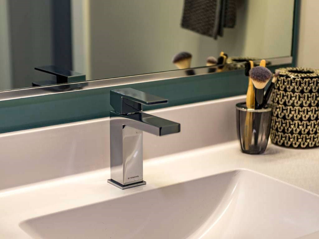 Close-up of bathroom sink faucet