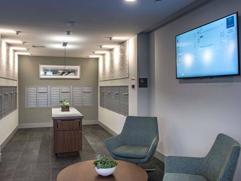 Mail center with mailboxes and seating area