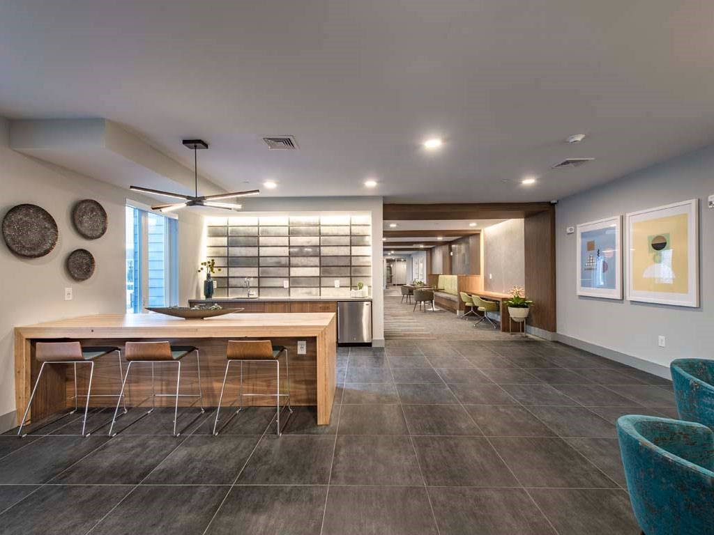 Amenity space with bar style seating and counter