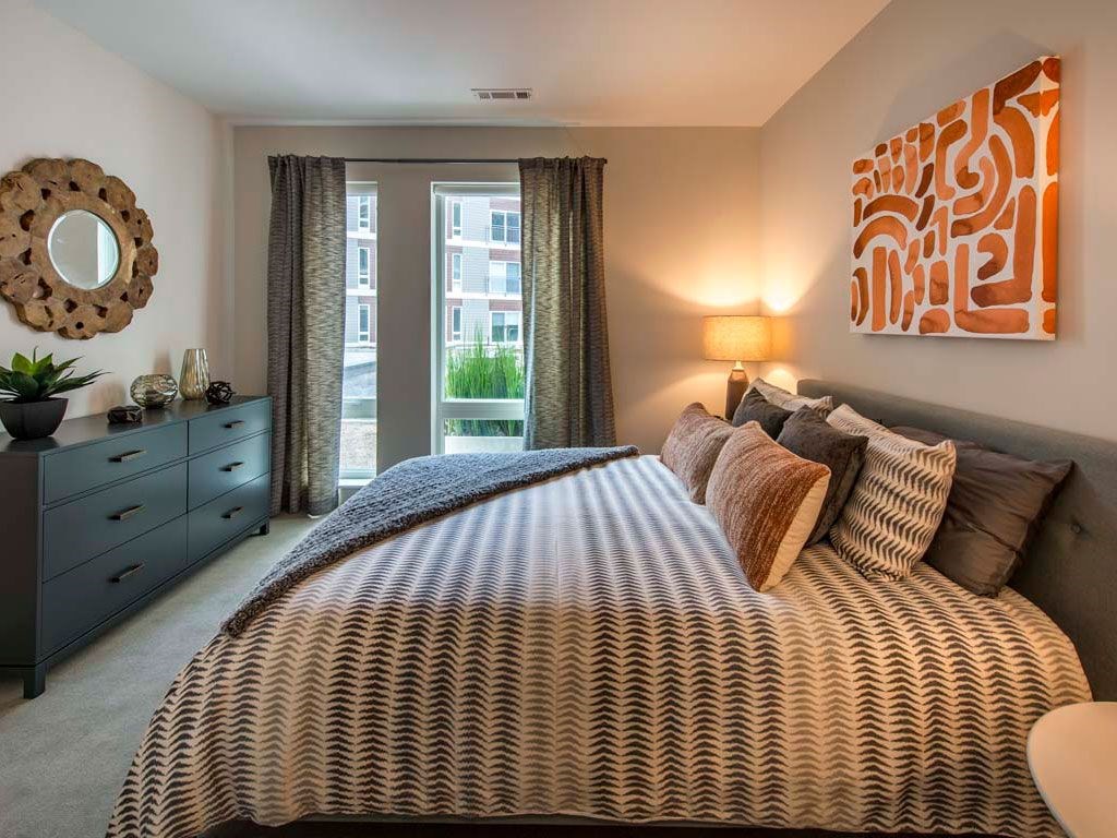 View of bedroom with large bed and window