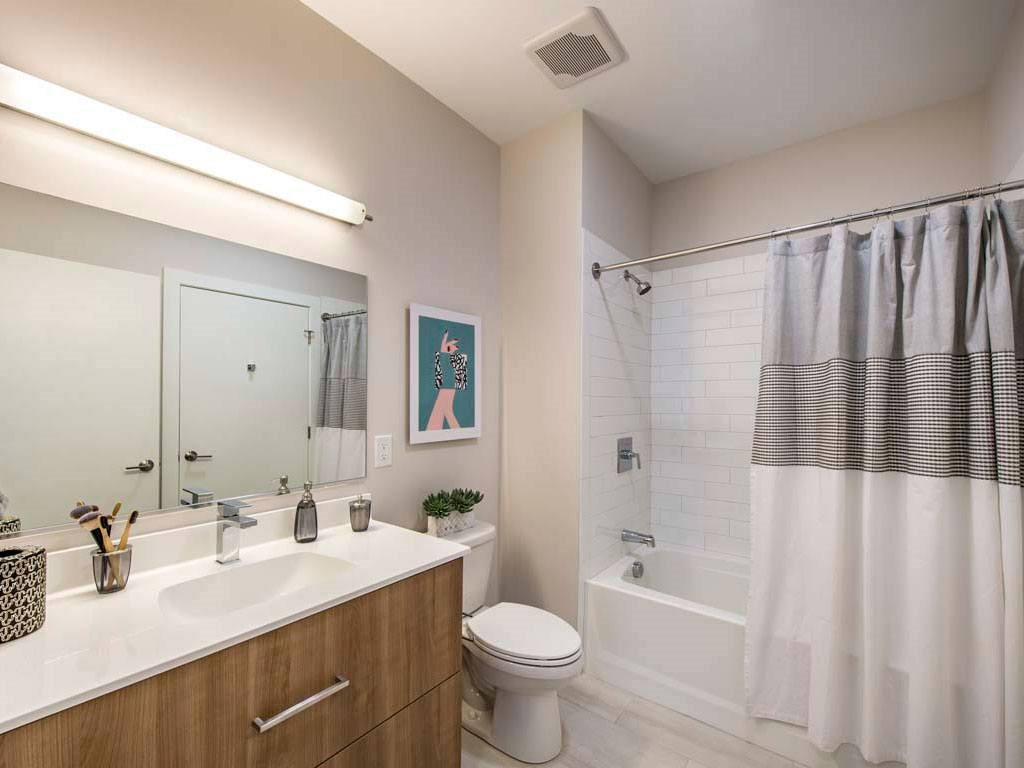 Bathroom with vanity, toilet and tub/shower