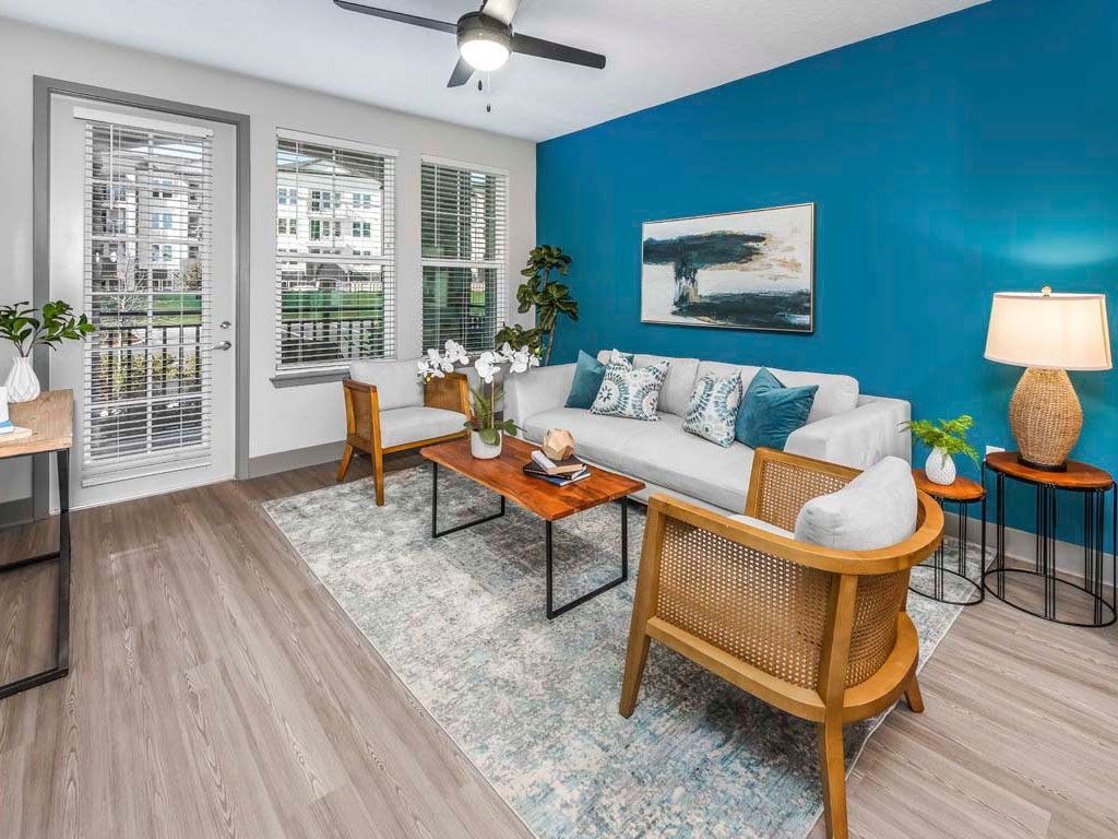 the westerly apartments orlando florida living room with windows and French door to patio