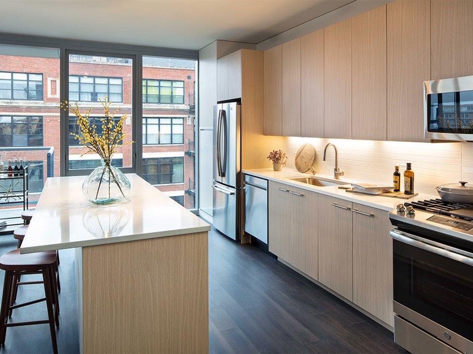 a kitchen with a large counter and a window