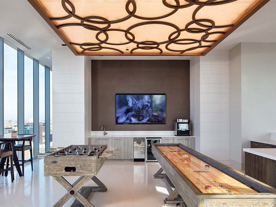 a game room with a table and a television