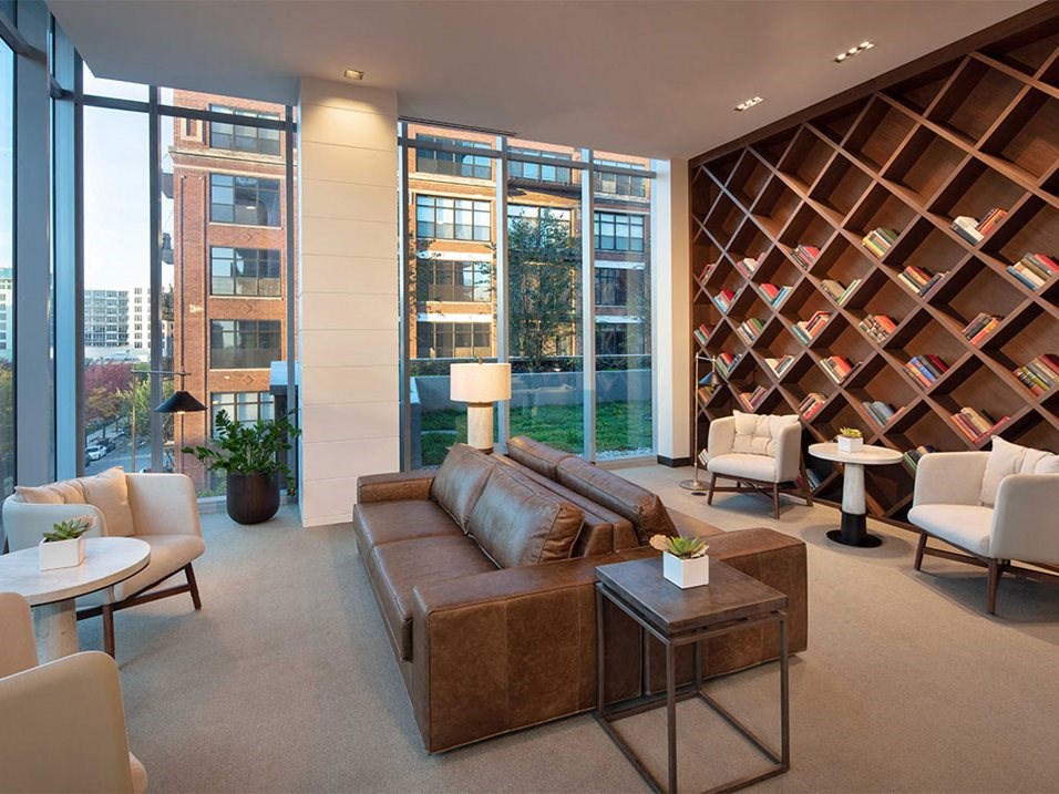 a living room filled with furniture and a wine cellar