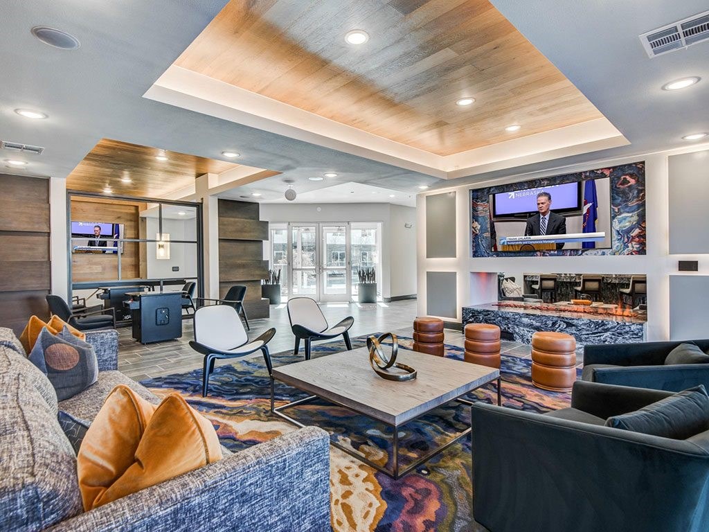 Game room and lounge with TV and gas fireplace