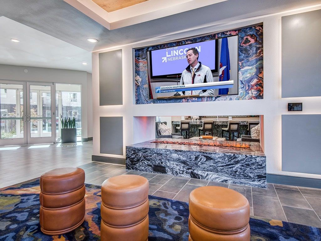 Game room and lounge with TV and gas fireplace