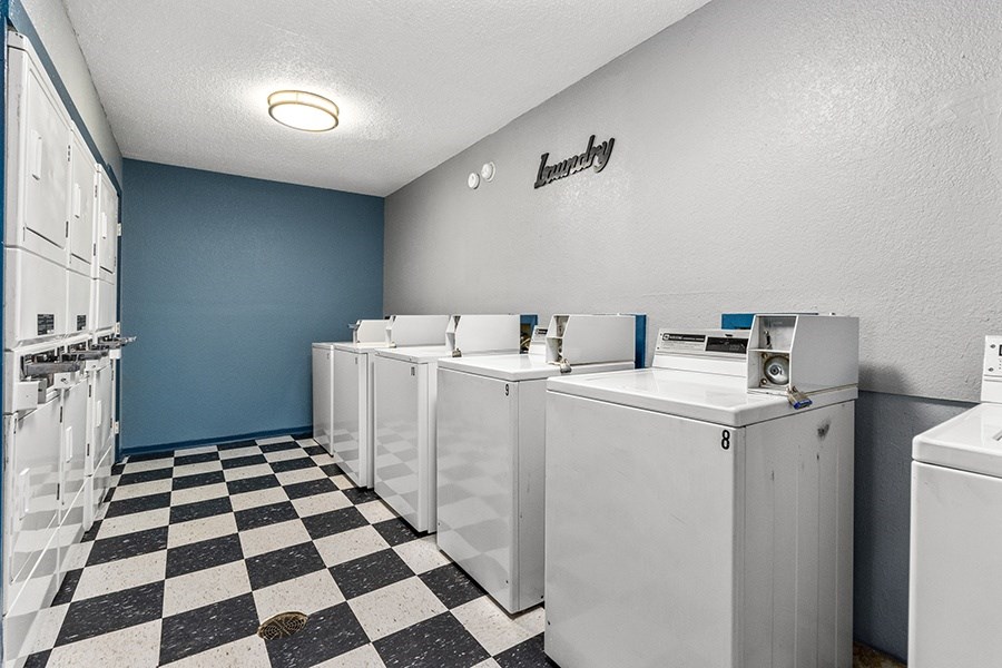 Laundry room with washers and dryers
