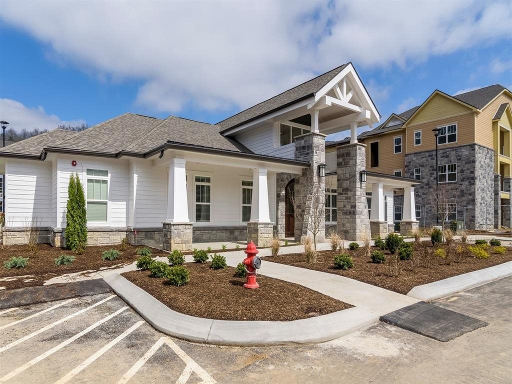a house with a fire hydrant in front of it