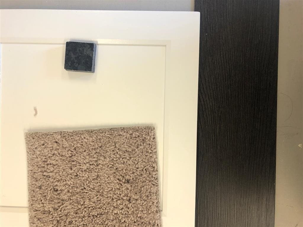 a towel hanging on a wall next to a door