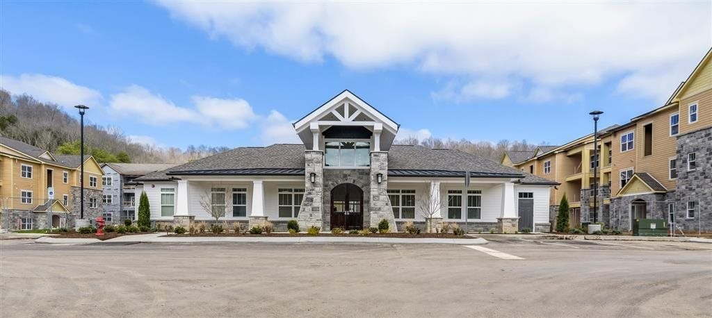 a large building with a parking lot in front of it