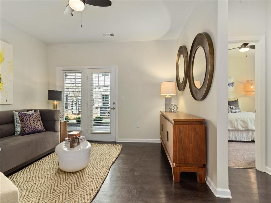 a living room with a couch and a dresser