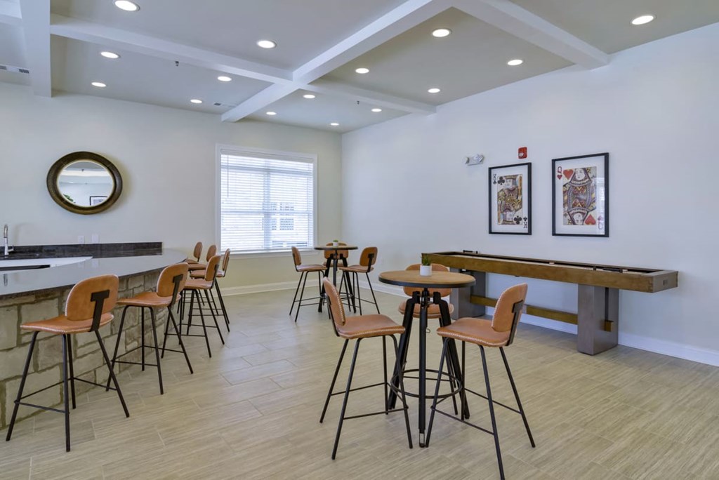 Ashland Farms Clubhouse Social Room with Shuffleboard and Various Table Seating