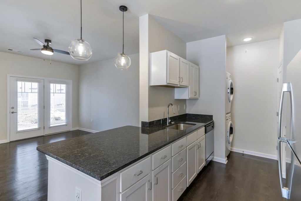 Ashland Farms Galley Style Kitchen with Ample Cabinet Storage and Separate Washer & Dryer Area