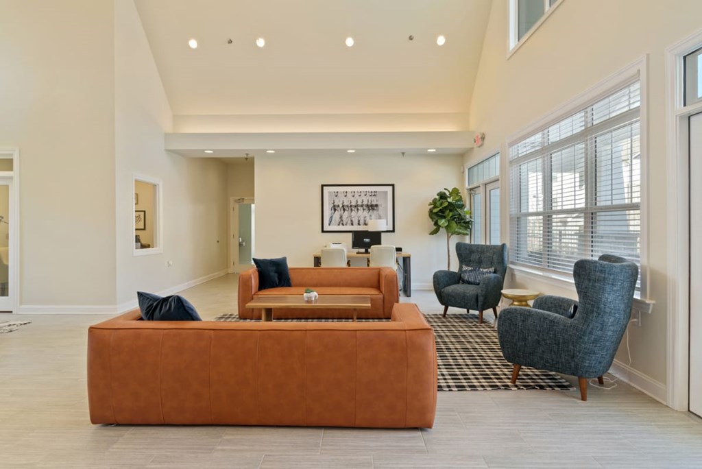 Ashland Farms Resident Clubhouse with Couch Seating, Modern Decor, and View of Pool Area