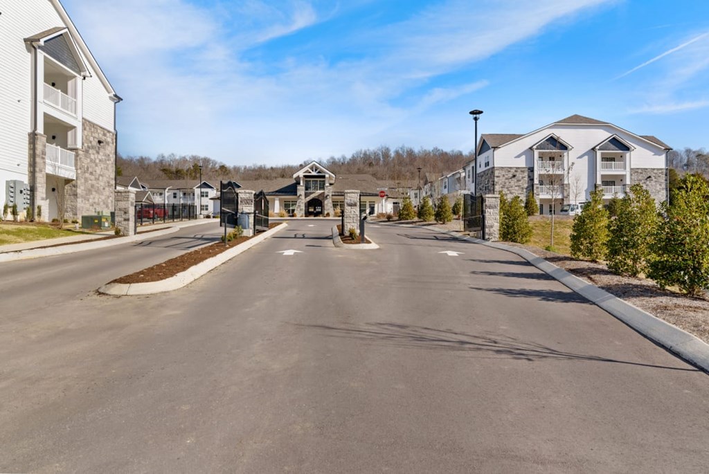 Ashland Farms Beautiful Gated Entrance to Apartment Community Surrounded by Lush Landscaping.