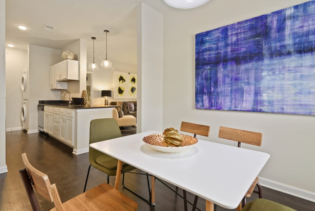 a dining room table with a bowl of bread on it