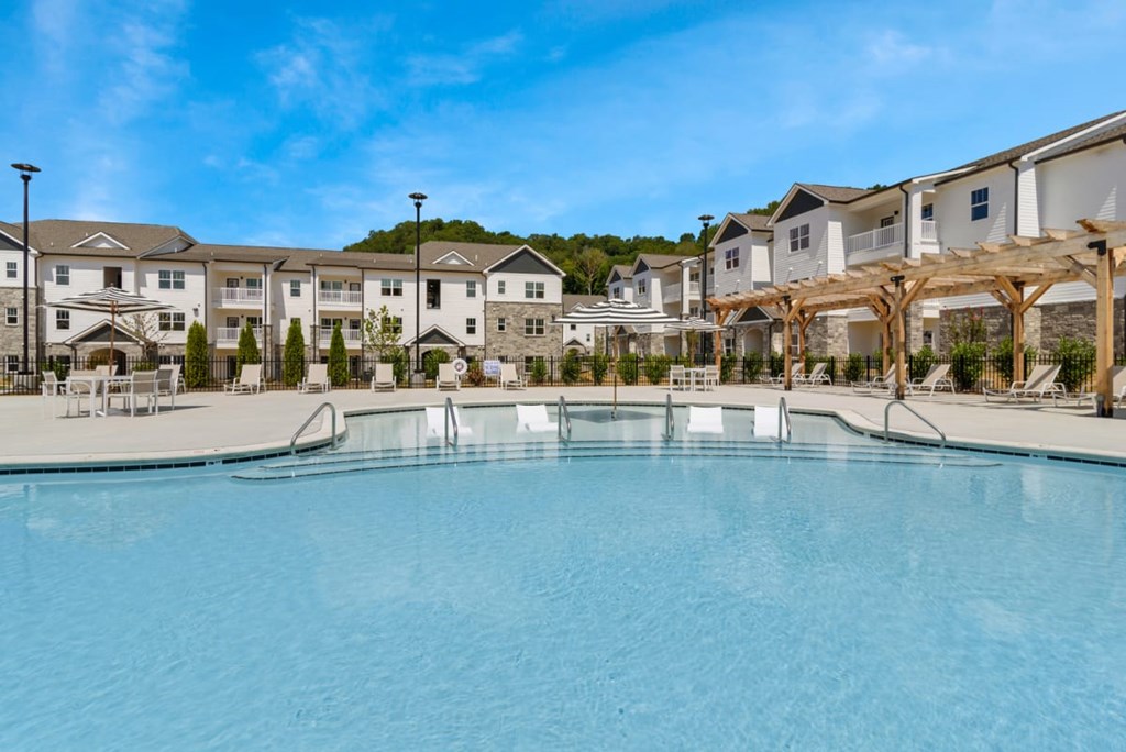 Ashland Farms Expansive Swimming Pool Area with Sundeck and Shaded Table Seating