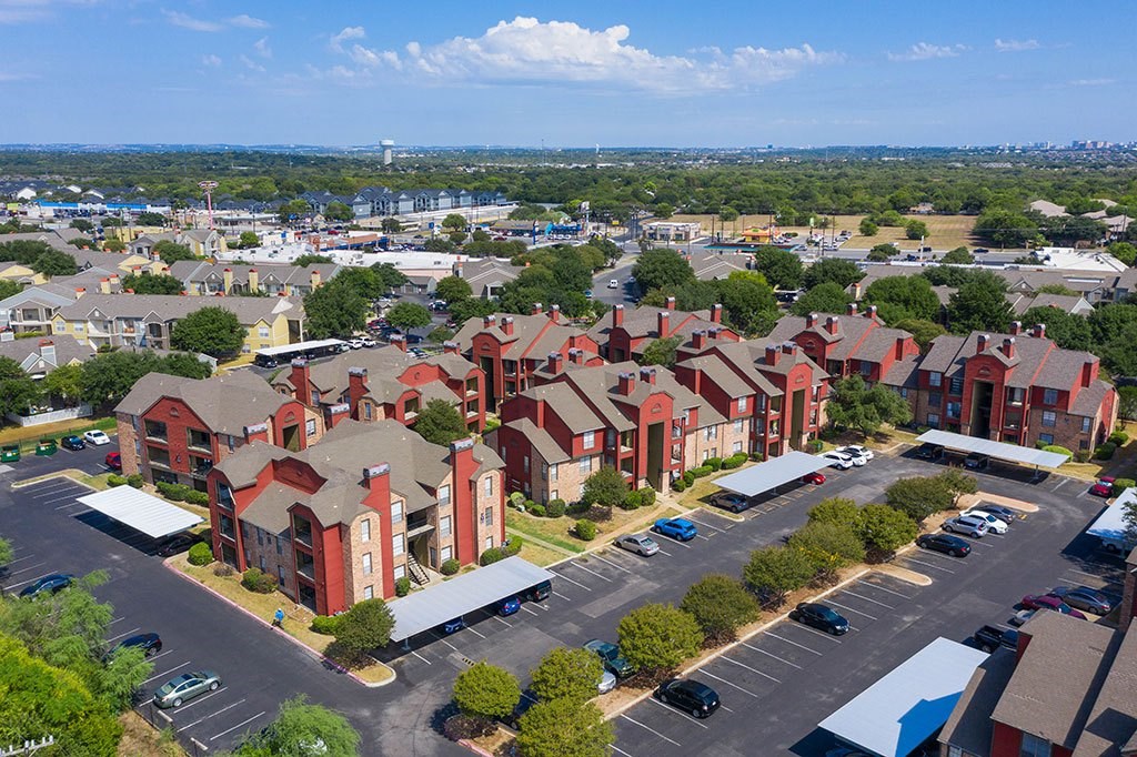 an aerial view of a neighborhood of houses in a parking lot
