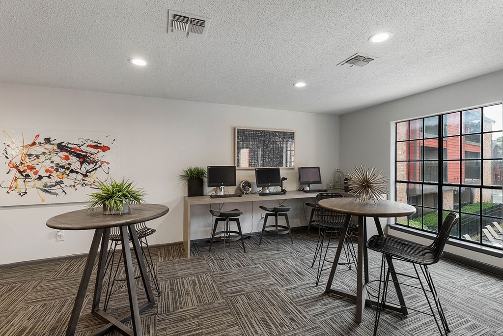 our apartments have an open floor plan with tables and chairs