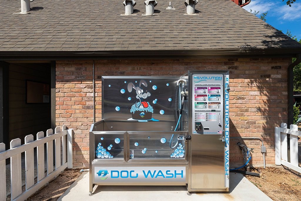 a dog wash vending machine in front of a house