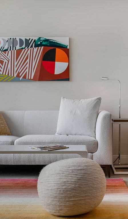 Couch with rug and ottoman