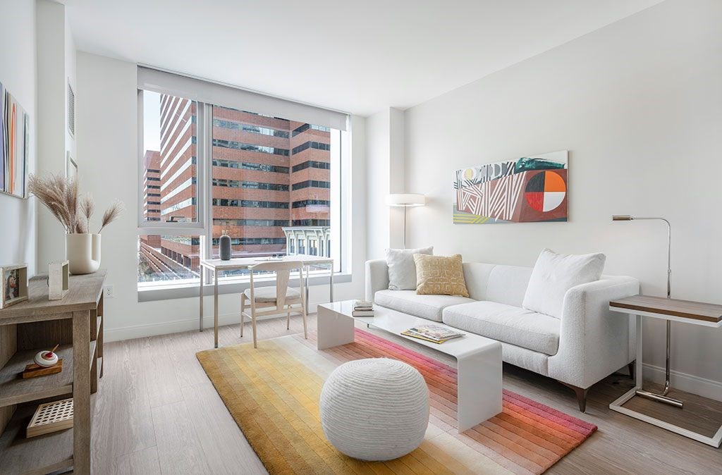 Living room with large window and city views
