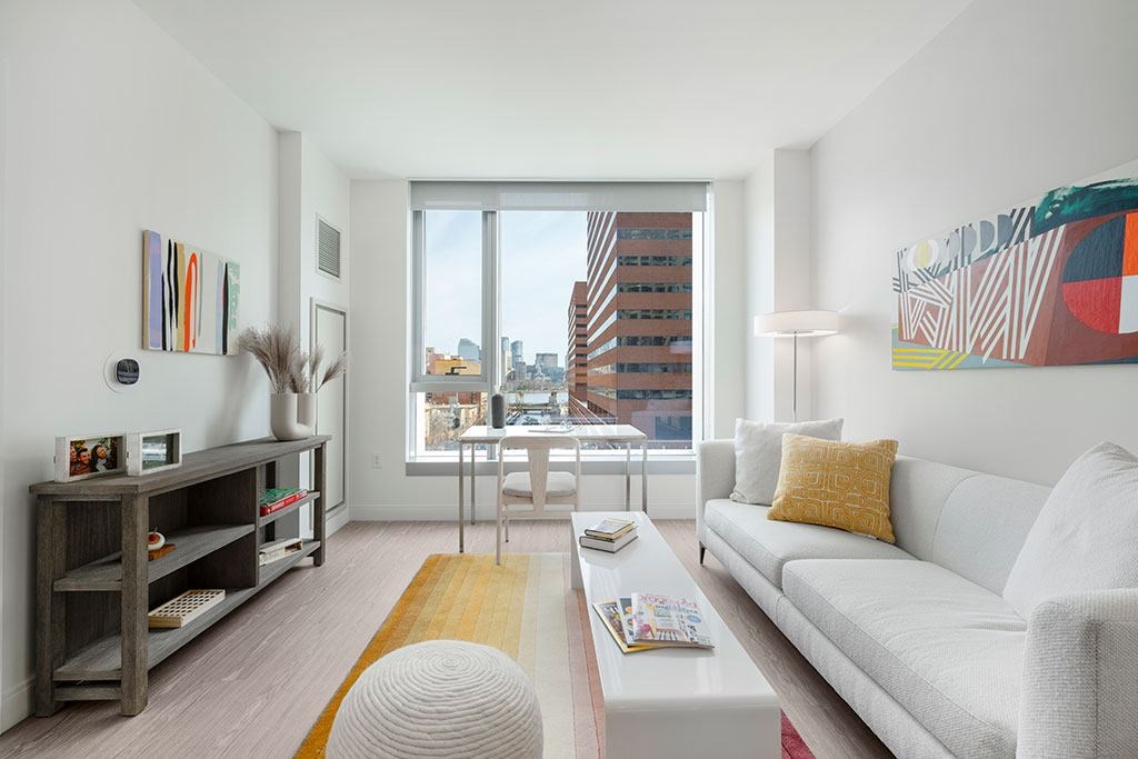 Living room with large window and city views
