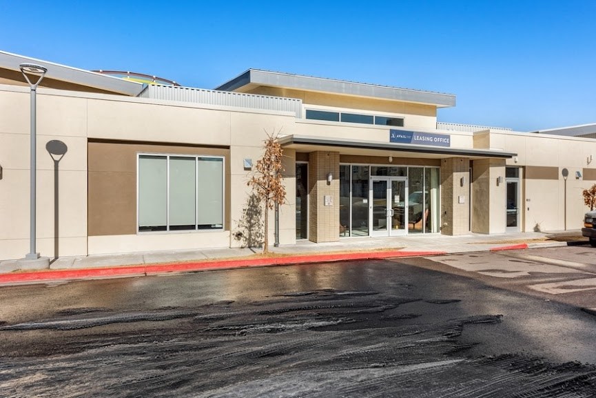 a building with a parking lot in front of it