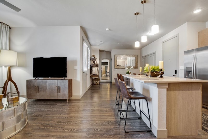 a view of the kitchen and living room from the dining area