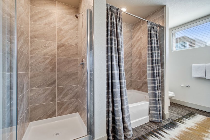 a bathroom with a shower and a toilet