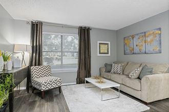 a living room with a couch and a chair